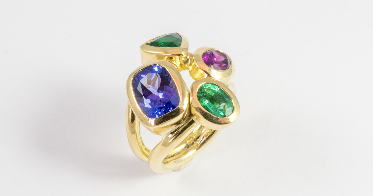 Birthstone ring with attitude and Tanzanite, Emerald and Garnet