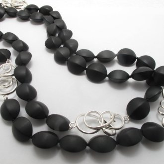 A NECKLACE of Matt Black Onyx Beads with Handmade Sterling Silver Elements.