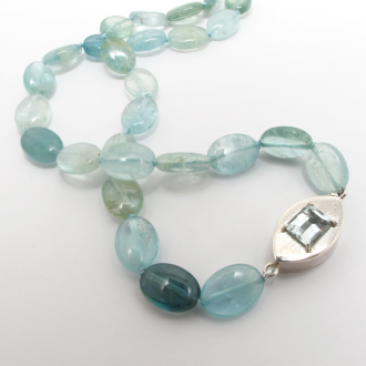 A Handmade Sterling Silver Clasp set with Step-cut Aquamarine on Tumbled Aquamarines