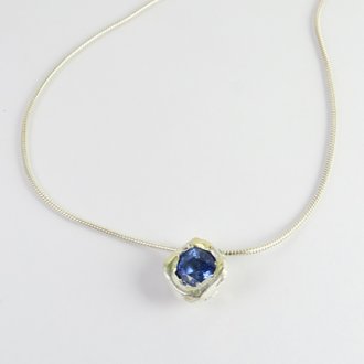 A Handmade Sterling Silver and 18ct Yellow Gold Blue Sapphire (0.86cts) PENDANT on Silver Chain.  Gold Mass 0.63 gms