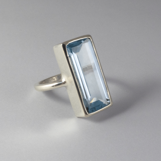 A Handmade Sterling Silver  RING  set with  Rectangular-cut Blue Topaz.
