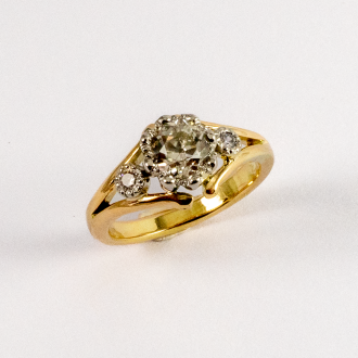 A Handmade 18ct Yellow Gold RING set with Old-cut diamond (0.81ct) and 2 Modern Round Brilliant cut Diamonds(0.06cts). Gold Mass 4.9 gms