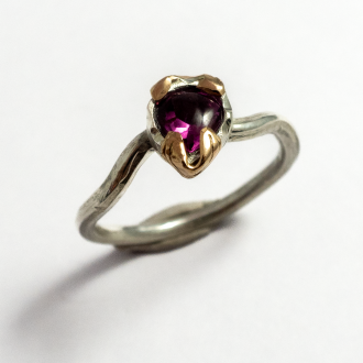 A Handmade Sterling Silver, 18ct Rose Gold and Almandine Garnet RING. Gold mass 0.25 gms. 
