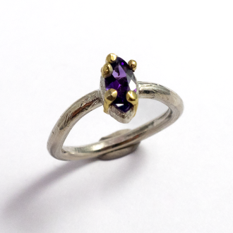 A Handmade Sterling Silver, 18ct Yellow Gold and Amethyst RING. Gold mass 0.45 gms.
