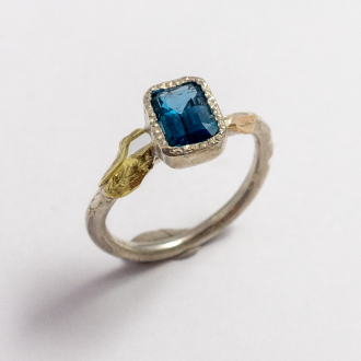 A Handmade Sterling Silver, Rose and Green Gold RING set with Blue Topaz. Gold mass 0.24 gms.