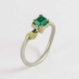 A Handmade Sterling Silver and 18ct Yellow and Green Gold Emerald RING. Emerald 0.56cts Gold Mass 0.36 gms. Birthstone for May.