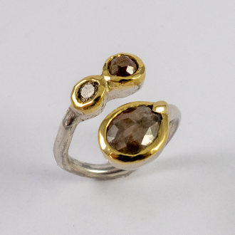 A Handmade Sterling Silver, 18ct Yellow GOld and DIamond Crossvoer RING. Diamonds: 1.07 Brown Rose-cut; 0.45 Brown Rose-cut; 0.12ct Cape Brilliant-cut. Gold 2.38 gms.