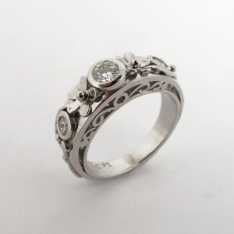 A Handmade Platinum and Diamond Flower RING, set with Round Brilliant-cut Diamonds