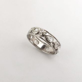 A Handmade Platinum Fancy Eternity RING with Rose-cut Diamonds and Flower detail.