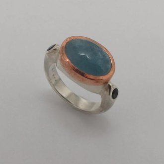 A Handmade Sterling Silver and Copper RING set with Aquamarine.