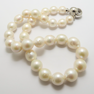 A NECKLACE of Whiter Semi-Baroque Freshwater Pearls on Silver Clasp