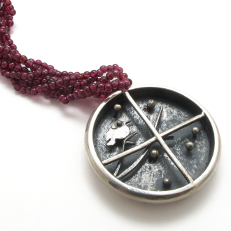 A Handmade Sterling SIlver Kinetic PENDANT "The Robin", on NECKLACE of Garnet Beads.