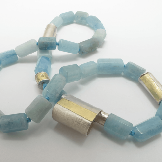 A NECKLACE of Aquamarine with Handmade Sterling Silver and 18ct Yellow Gold Elements and Clasp