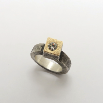 A Handmade Sterling Silver and 9ct Gold RING set with Diamond.