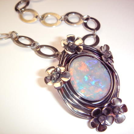 Enchanting Rainbow Moonstone set in a daisy-encrusted wire nest  with Handmade Chain. 