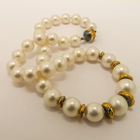 A NECKLACE of South Sea Pearls with Handmade Sterling Silver and Fine Gold Elements and Clasp