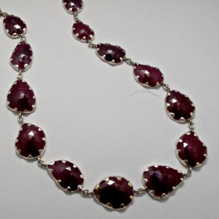 A Handmade Sterling Silver, 14ct Rose Gold and Ruby Riviere NECKLACE. Gold mass 0.8 gms.