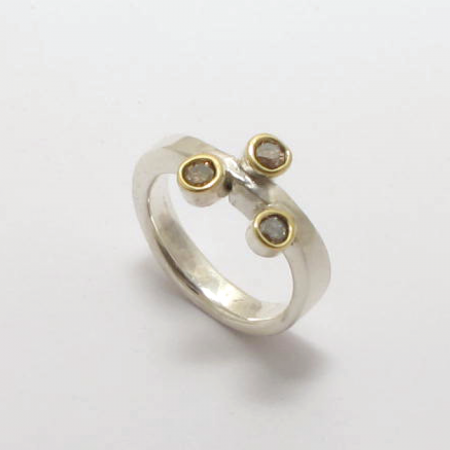 A Handmade Sterling Silver and 18ct Yellow Gold RING set with Fancy Brown Diamonds.