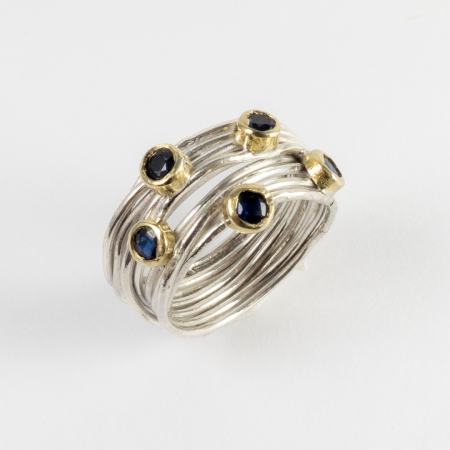 A Handmade Sterling Silver, 18ct Yellow Gold Wire RING, set with 5 Blue Sapphires (0.70 ct).  Gold Mass 1.81 gms. 