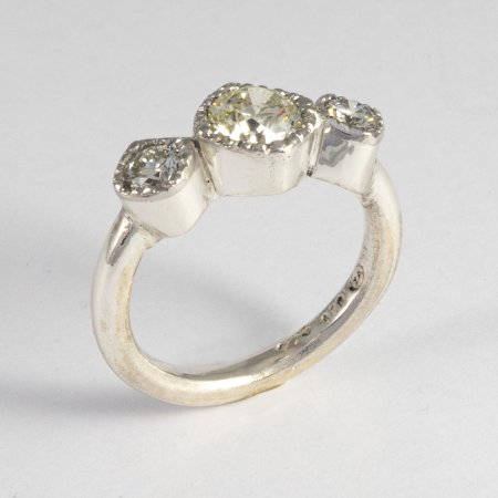 A Handmade Sterling Silver and Platinum 3-stone Diamond RING. Total Diamond Weight 1.37 ct. Platinum mass 1.4 gms.