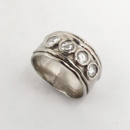 A Handmade Platinum and Four-Stone Rose-cut Diamond RING.