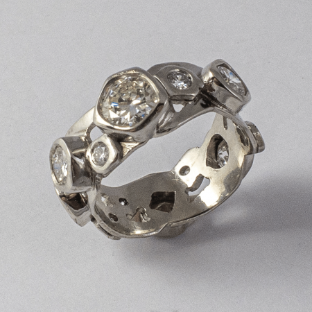 A Handmade Platinum Diamond Set RING having 13 Round Brilliant-cut Diamonds.  