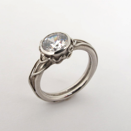 A Handmade Platinum and Diamond Engagement RING with Heart Motifs. Plat Mass 8 gms.