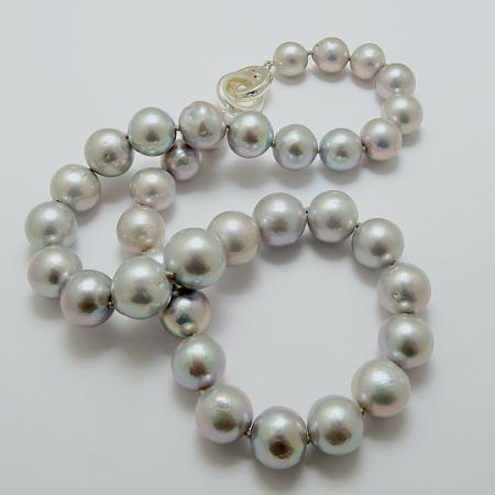 A NECKLACE of Round Grey Freshwater Pearls on Sterling Silver Clasp.11-14.5 mm in Diameter.