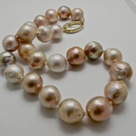 A NECKLACE of Natural Off-Round  Freshwater Pearls.