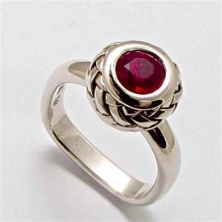 A Handmade Platinum RING with Basket Weave Technique, set with a Ruby 
