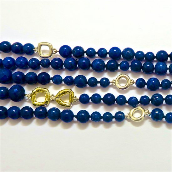 A NECKLACE of Assorted Lapis Lazuli with Handmade Sterling Silver and 18ct Yellow Gold Elements and Clasp.