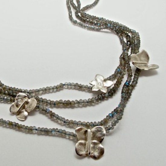 A NECKLACE of Labradorite with Handmade Sterling Silver 'Fingerprint' Butterfly and Flower Elements.