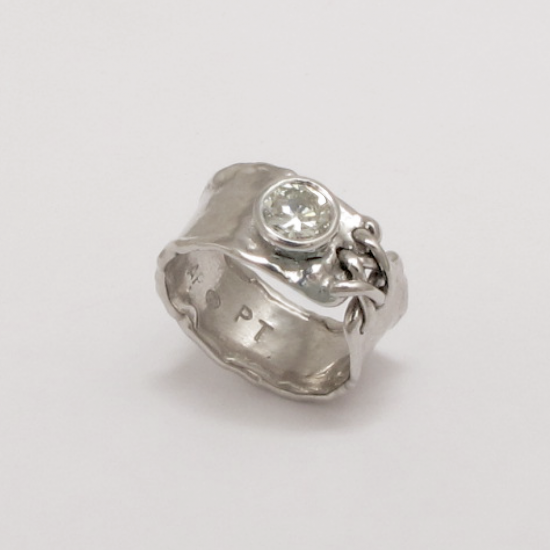 A Handmade Platinum RING set with Round Brilliant-cut Diamond.