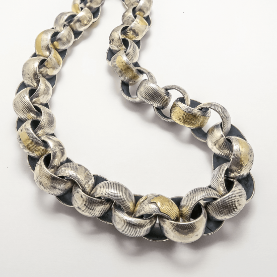 A Handmade Textured Sterling Silver and 18ct Yellow Gold Round Link NECKLACE. Gold mass 4.8 gms.