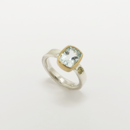 A Handmade Sterling Silver and 18ct Yellow Gold RING set with Aquamarine and Natural Cape Diamond. (0.13ct.). Gold mass 2 gms