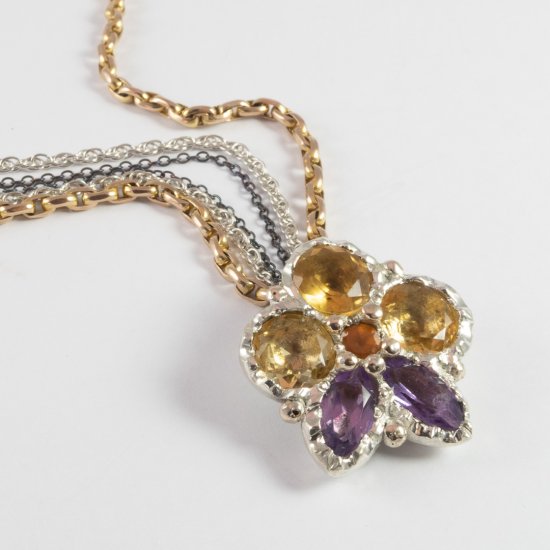 A Handmade PANSY PENDANT. Sterling Silver.9ct Rose Gold,  Diamond, Amethyst, Citrine and Hessonite.  Silver and Antique Gold  Chain.