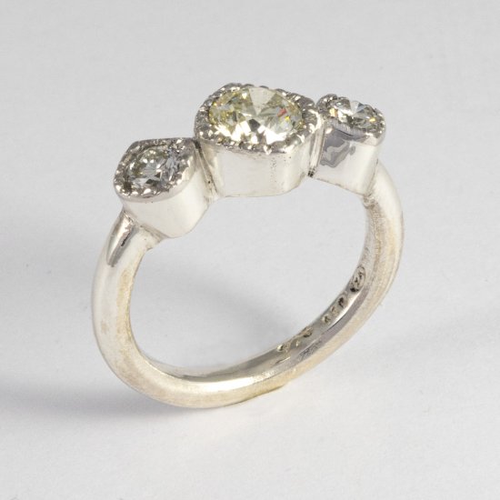 A Handmade Sterling Silver and Platinum 3-stone Diamond RING. Total Diamond Weight 1.37 ct. Platinum mass 1.4 gms.