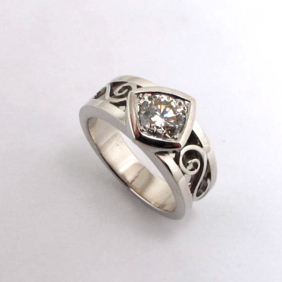 A Handmade Platinum and Round Brilliant-cut Diamond RING.