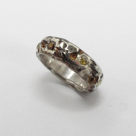 A Handmade Sterling Silver RING, set with Rose-cut  Diamonds. Total Diamond Weight .69cts.