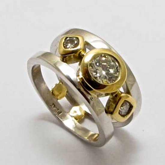  A Handmade Platinum and 18ct Yellow Gold RING set with Diamonds.  