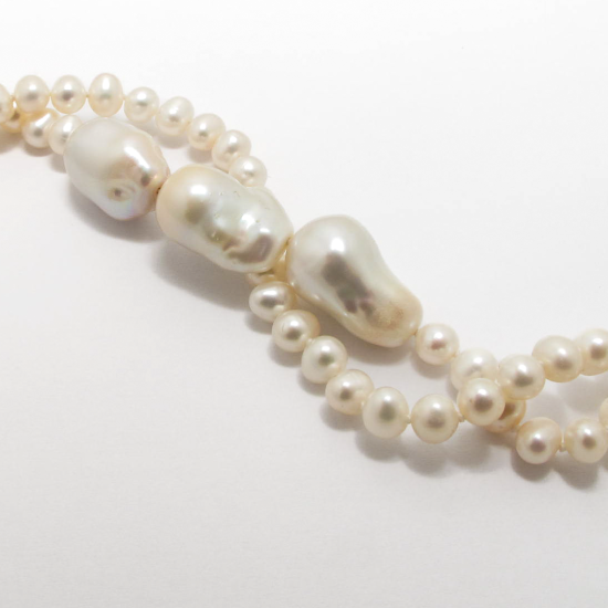 A NECKLACE of White Freshwater Pearls. 6mm Dia. Length 120cm.