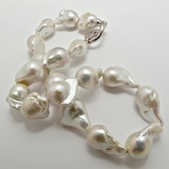 A NECKLACE of XXL White Baroque Freshwater Pearls on Silver Clasp.