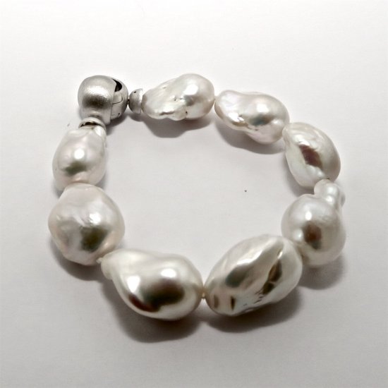 A BRACELET of XL Baroque Freshwater Pearls on Sterling Silver Clasp.
