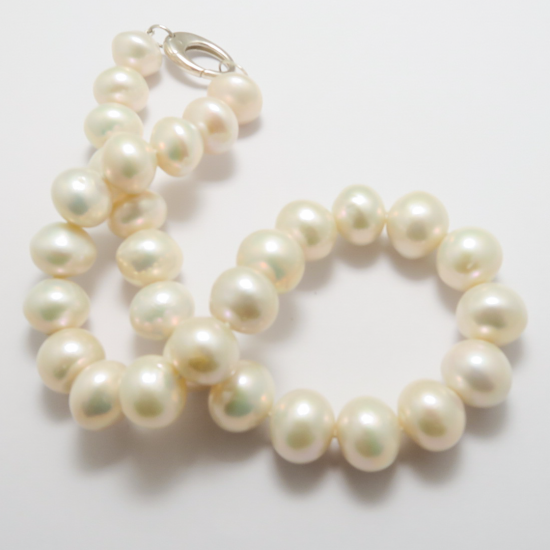 A NECKLACE of Whiter Freshwater Pearls on Sterling Silver Lobster Clasp.