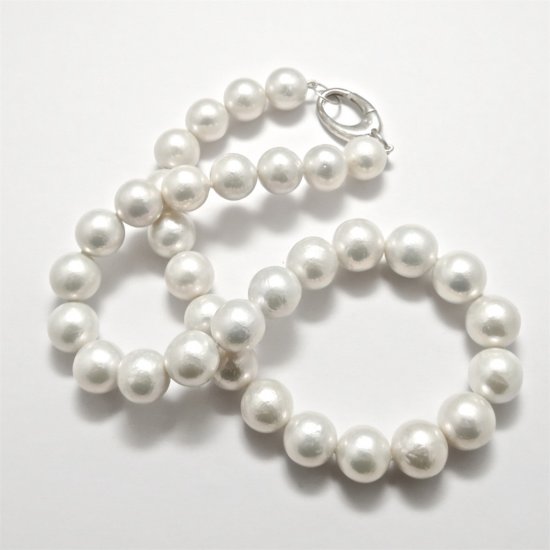 A NECKLACE of Round Freshwater Pearls on Sterling Silver Clasp. 11-13mm in Diameter