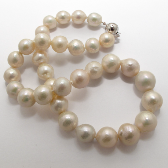 A NECKLACE of White XL Semi-Baroque Freshwater Pearls on Silver Clasp.