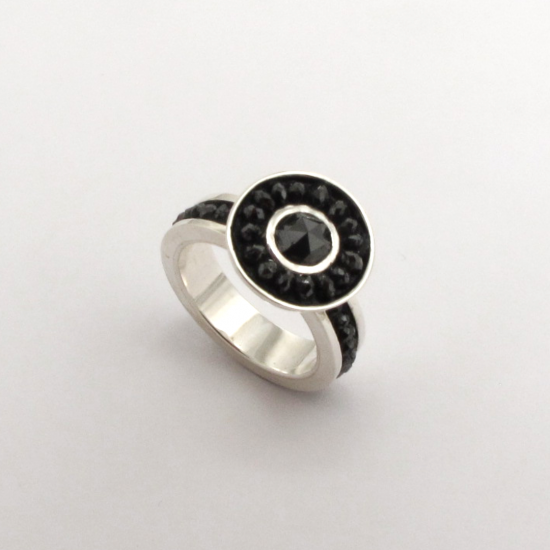 A Handmade Sterling Silver Ring set with Rose-cut Black Diamond (1.13cts.) and Facetted Black Diamonds (6cts.).