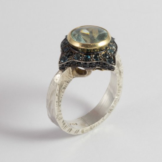 A Handmade Sterling Silver and 18ct Yellow Gold RING set with Buff-cut Aquamarine, London Blue Topaz and Black Spinel.