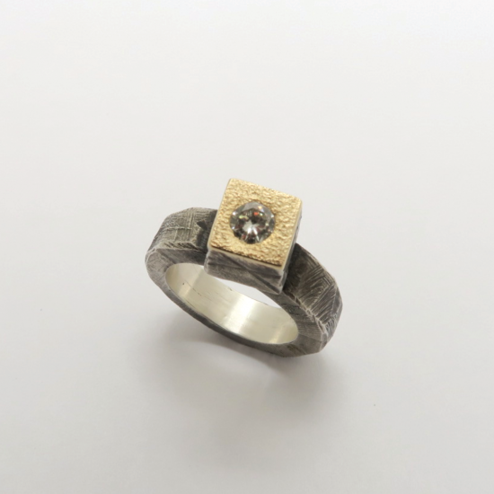 A Handmade Sterling Silver and 9ct Gold RING set with Diamond.